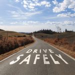 Safe driving message on the sunny road
